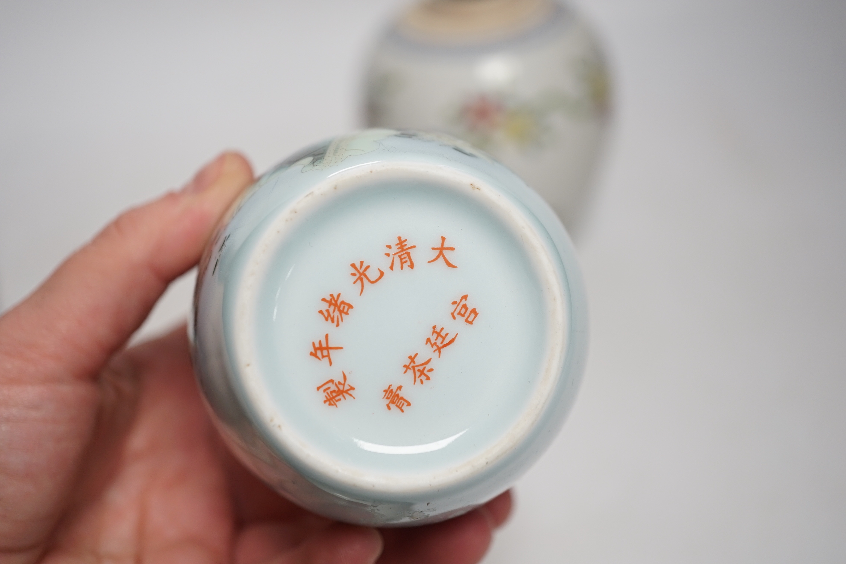 A collection of Chinese ceramics including celadon bowl decorated in low relief with fish, famille rose tea bowls and a jar, largest 12cm high